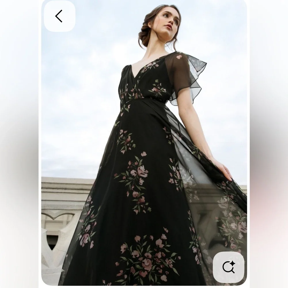 Jenny Yoo Cassie
Flutter Sleeve
Surplice Gown
Black with Floral Pattern. - Picture 1 of 16